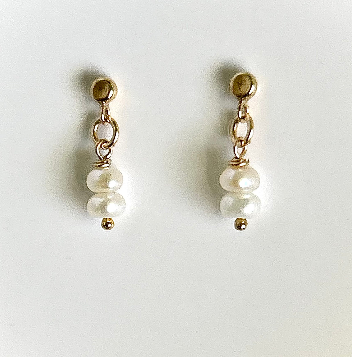 Tiny pearl studs